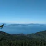 A view from a high place over water and distance islands on a sunny day