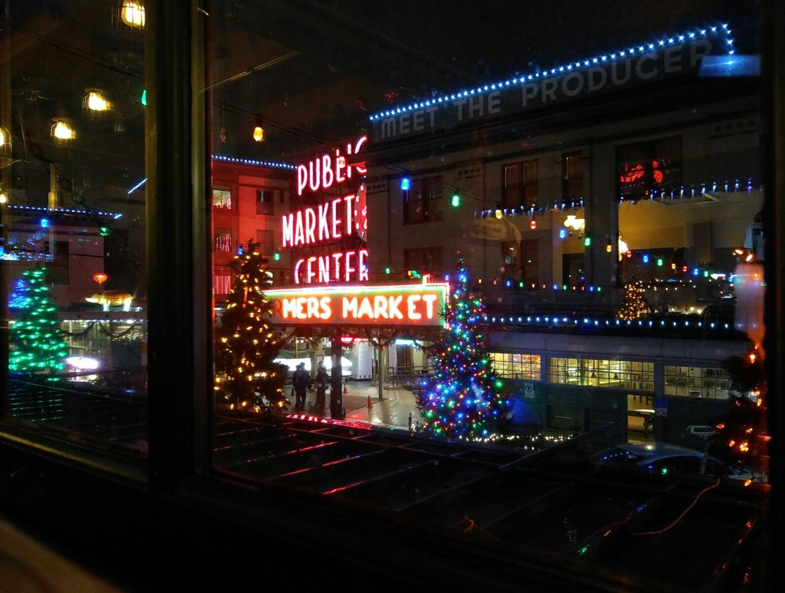 Pike place market in seattle in winter with holiday lights at night