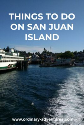 A ferry approaching the small town of Friday Harbor, with some buildings, boats and trees. Text reads: things to do on San Juan Island