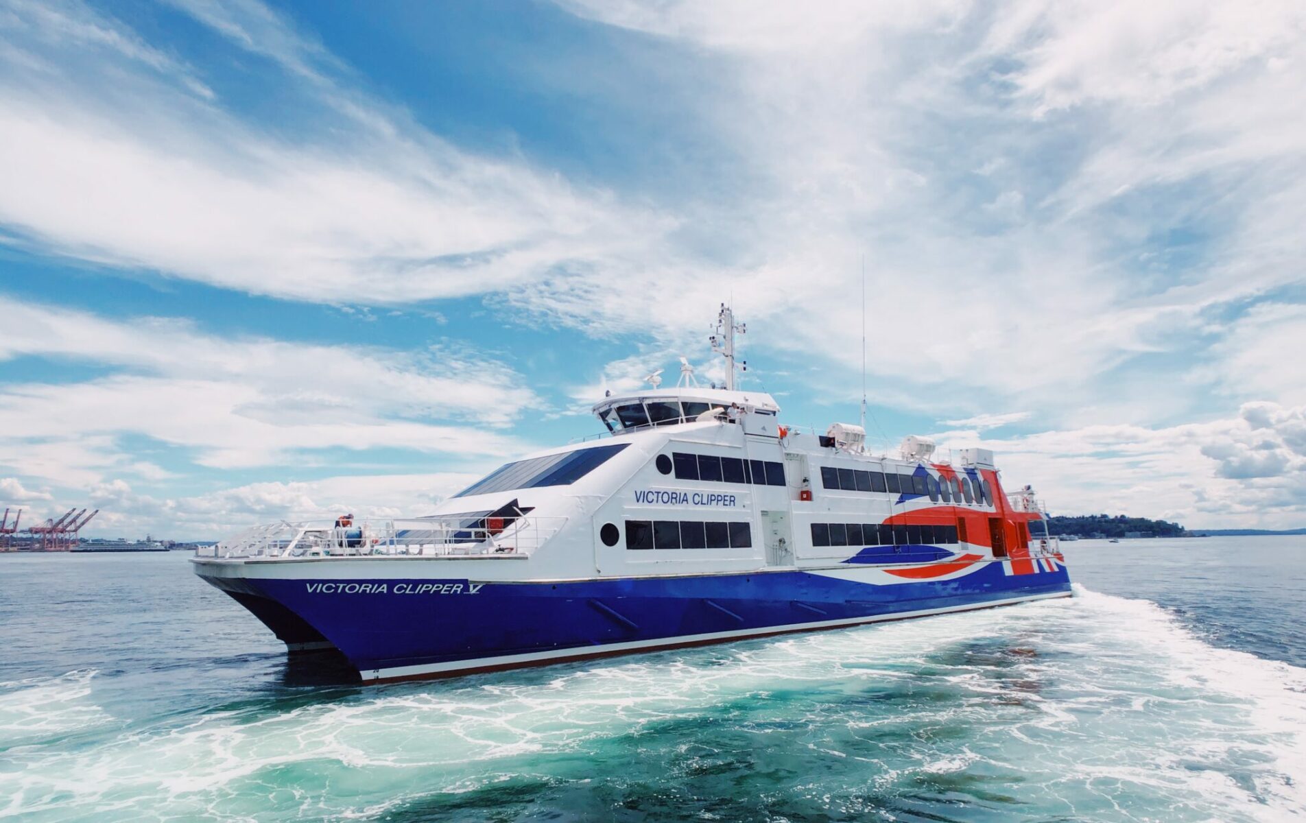 The Victoria Clipper, a red, white and blue catarmaran in Seattle's harbor going on a day trip to Victoria BC