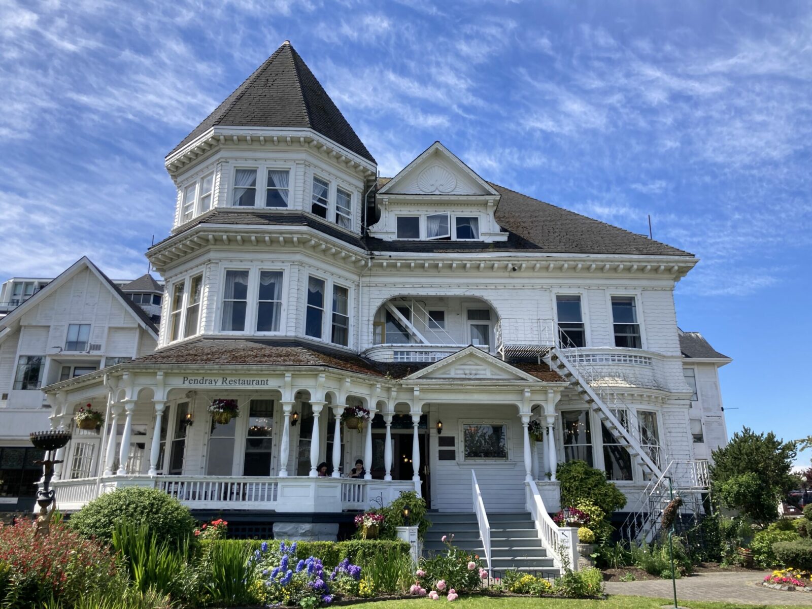 A large, white Victorian home where the Pendray Tea house is located in Victoria BC.