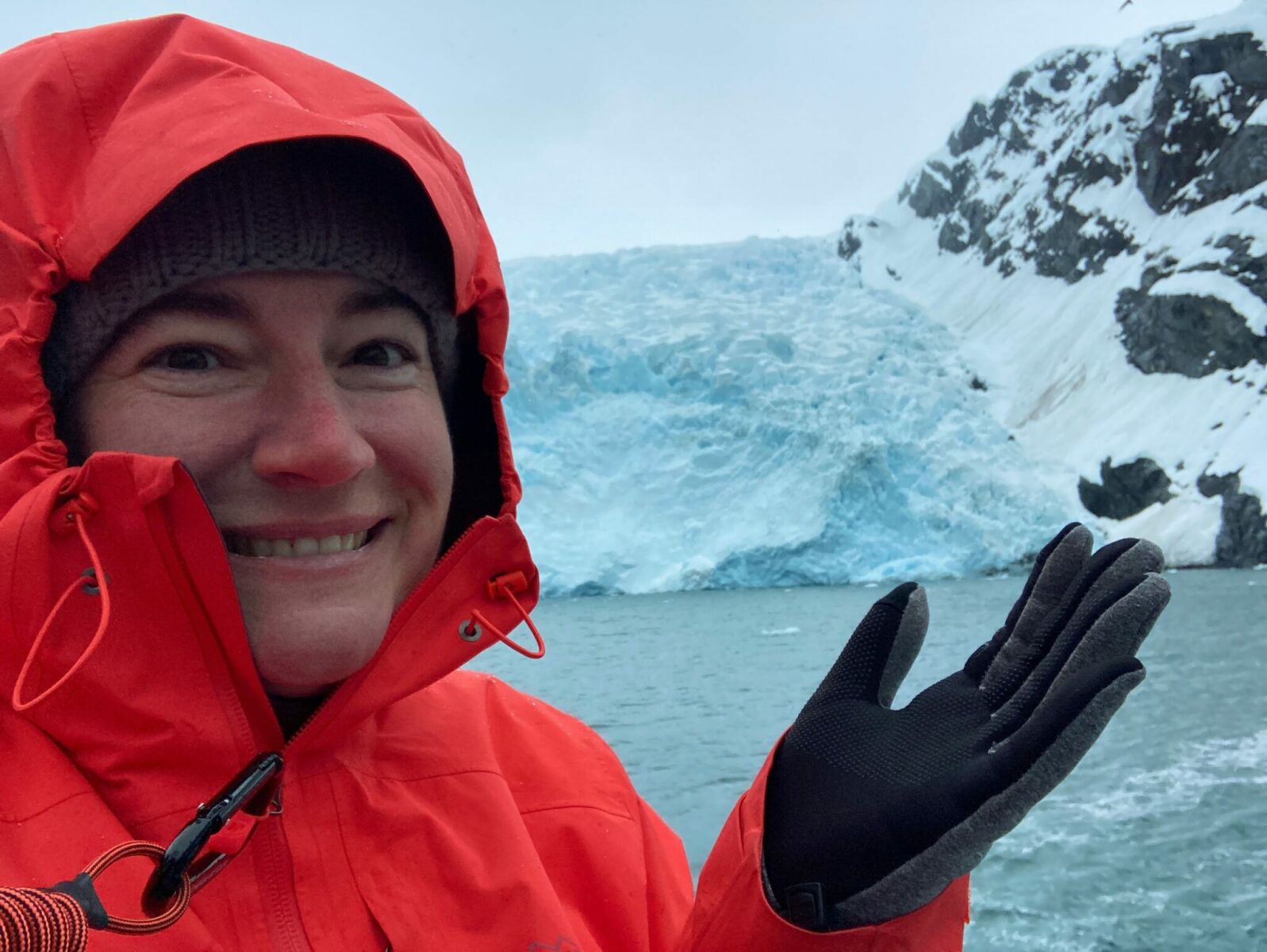 Jennie in front of a glacier on a boat in Prince William Sound