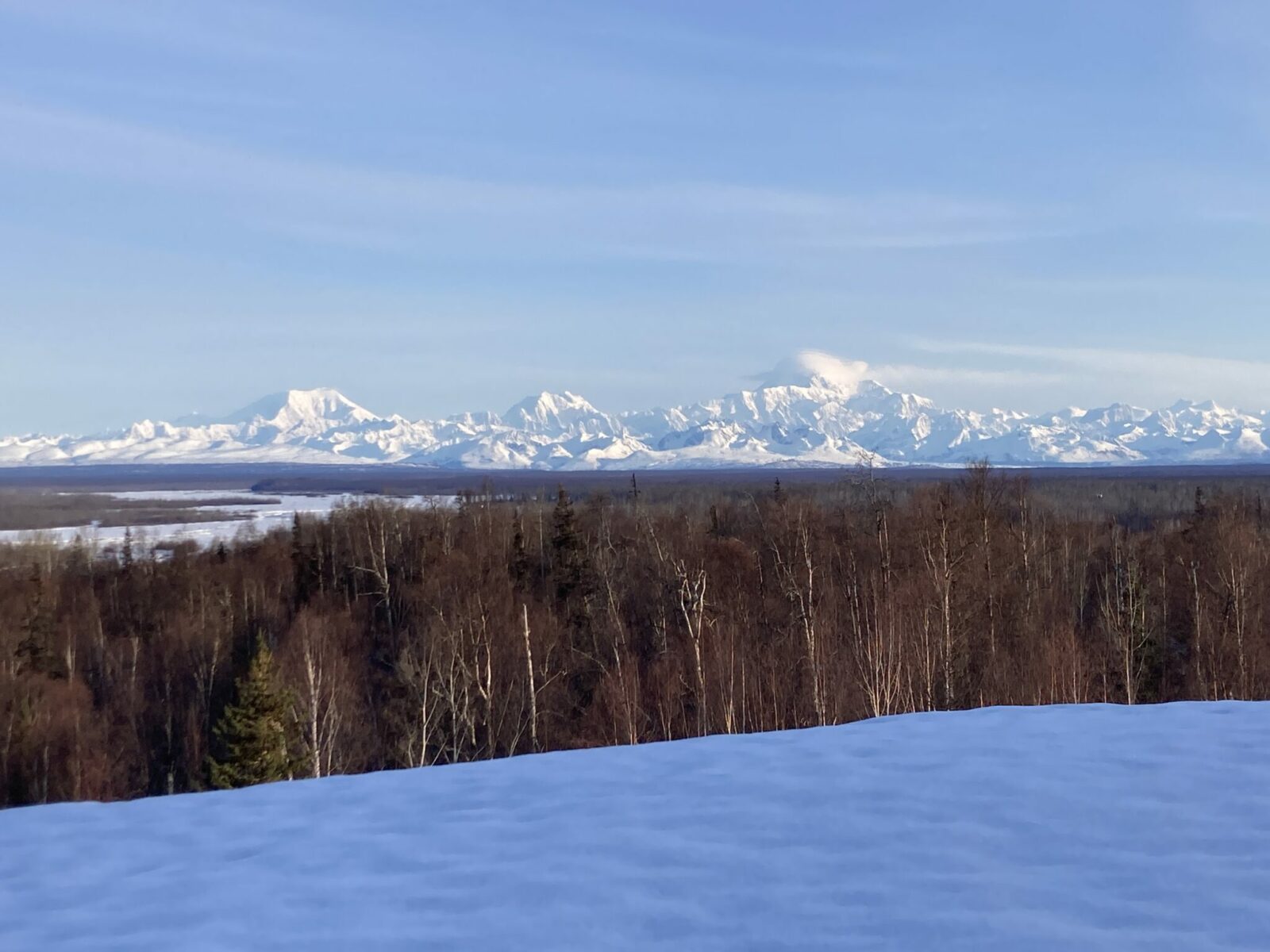 An early morning view of the Alaska Range, including Mt Denali from the deck of the Talkeetna Alaskan Lodge.