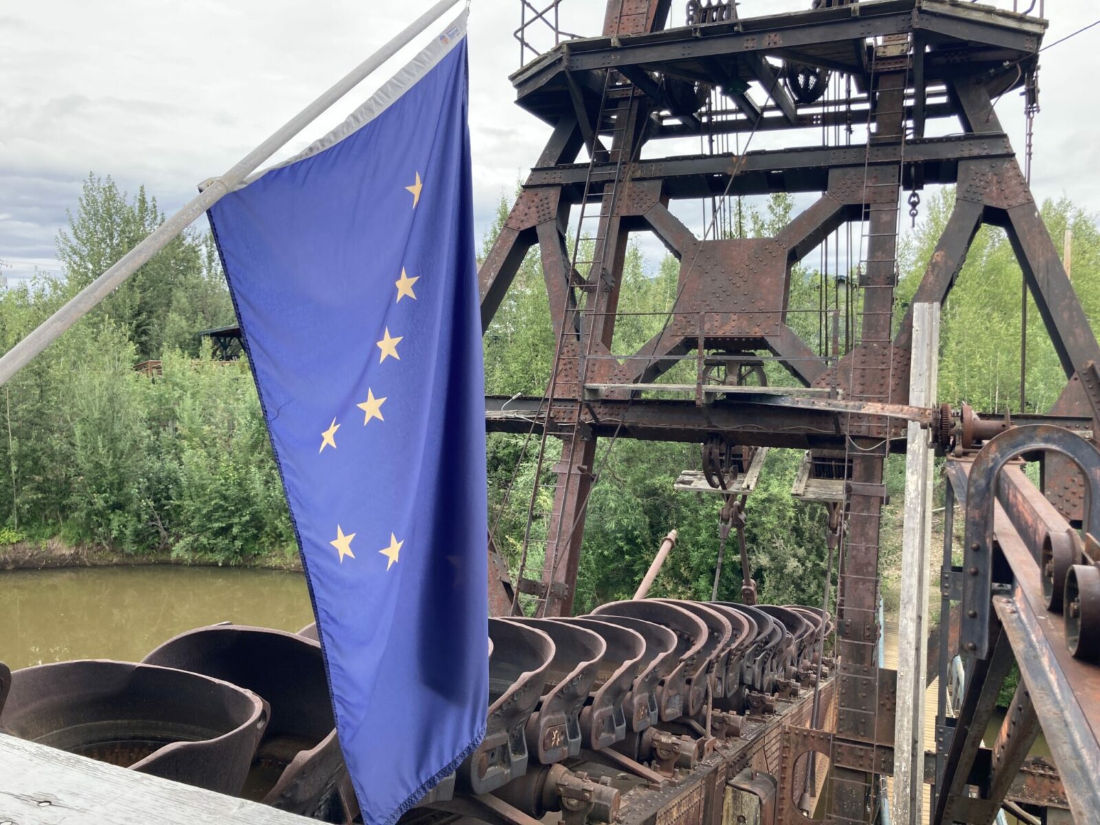 An Alaska flag over the buckets at historic Gold Dredge 8 in Fairbanks