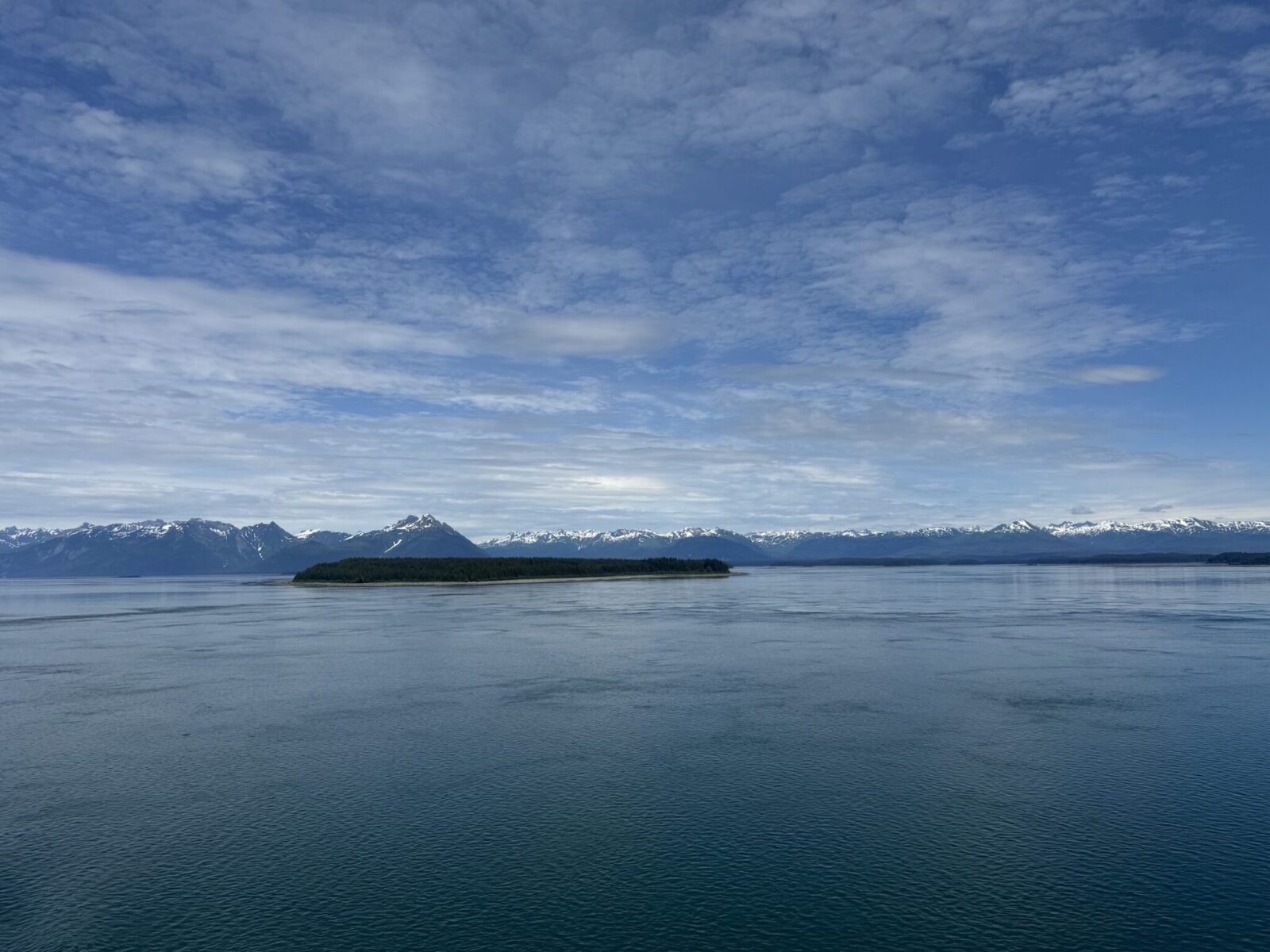 Mountains, an island and water between Glacier Bay and Juneau